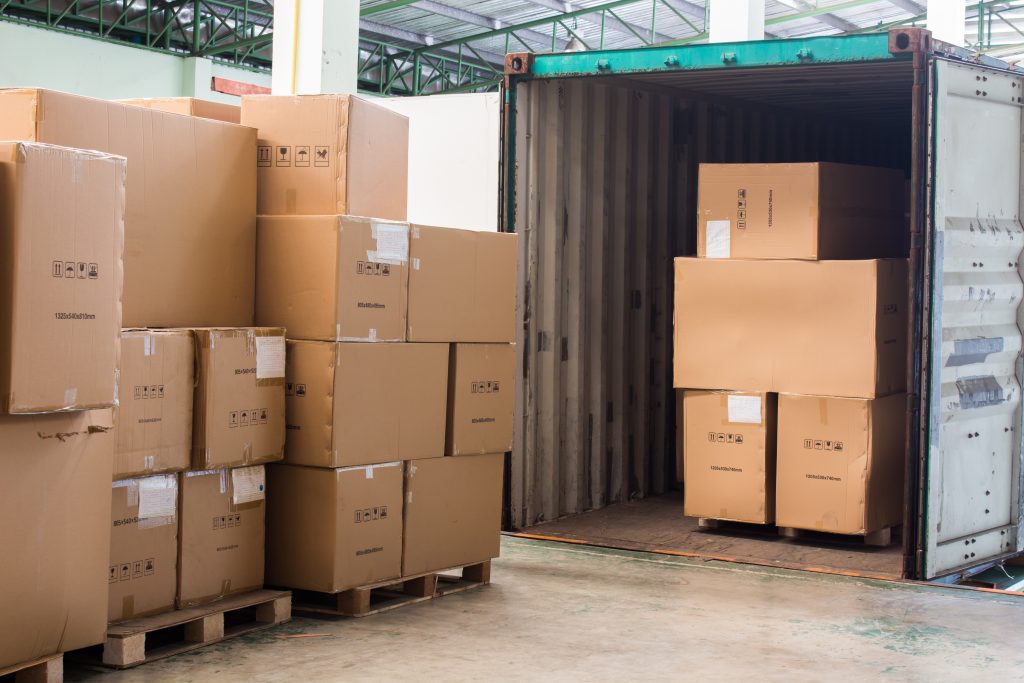 shipping cartons coming out of containers